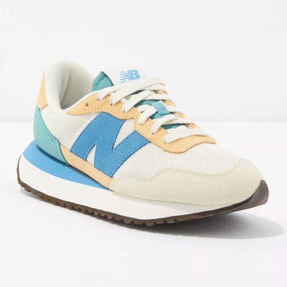 New Balance Women's 237 Sneaker with Peach/Blue/Cream colors, size 9 - Picture 1 of 11
